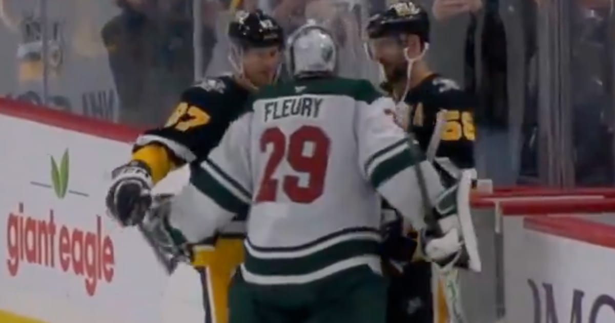 Sidney Crosby and Kris Letang of the Pittsburgh Penguins giving Minnesota Wild goalie Marc-Andre Fleury a hug
