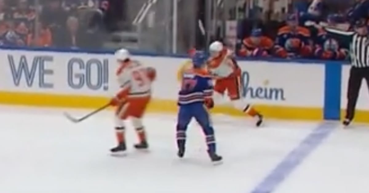 Connor McDavid tries to hit Trevor Zegras