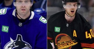 Jake DeBrusk and Elias Pettersson of Vancouver Canucks